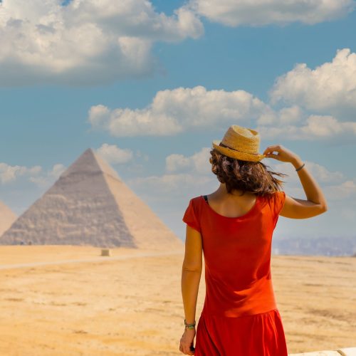 young-female-tourist-red-dress-looking-pyramids-giza-egypt-against-cloudy-sky-scaled-500x500 young-female-tourist-red-dress-looking-pyramids-giza-egypt-against-cloudy-sky-scaled-500x500